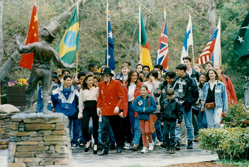 Lisa Marie Presley and Michael Jackson welcome a crowd of children to the Neverland Ranch - Vintage Photograph