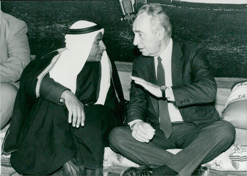 Israeli politician Shimon Peres in conjunction with a Bedouin Sheikh during his visit to Negev. - Vintage Photograph