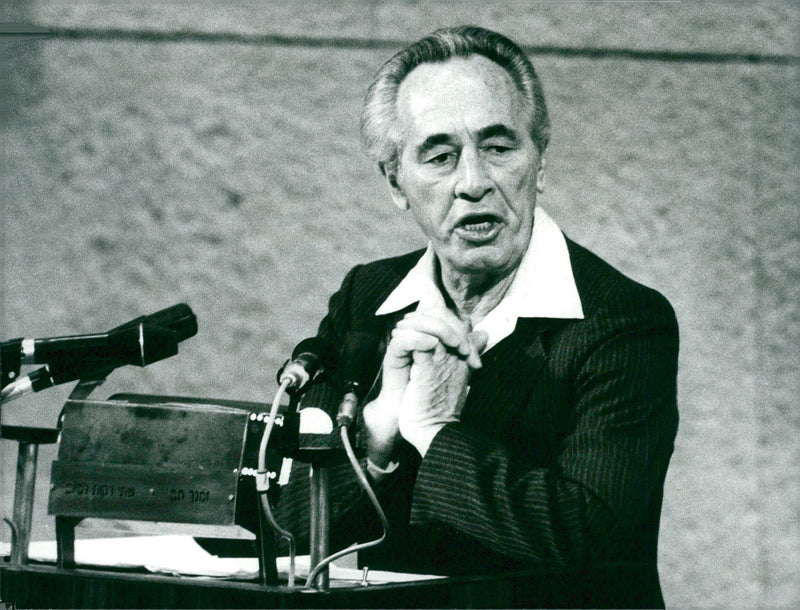 Israeli politician Shimon Peres talks during a press conference. - Vintage Photograph