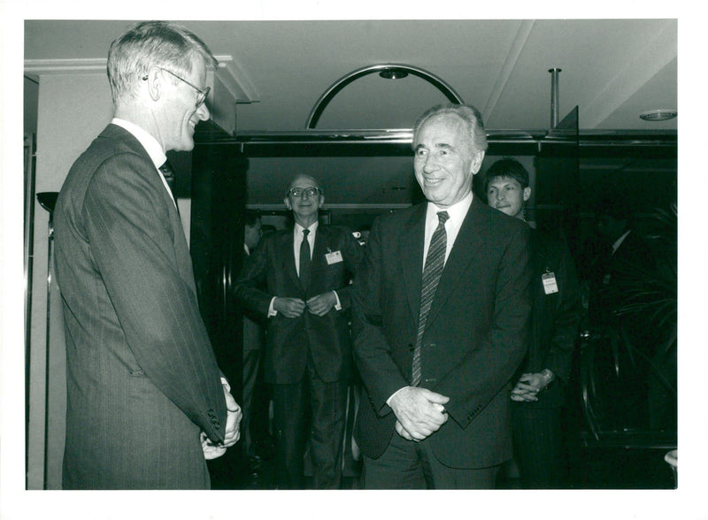 Israeli politician Shimon Peres in agreement with Ingvar Carlsson. - Vintage Photograph