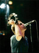 Rock group Oasis member, Liam Gallanger, rock the stage during the group&