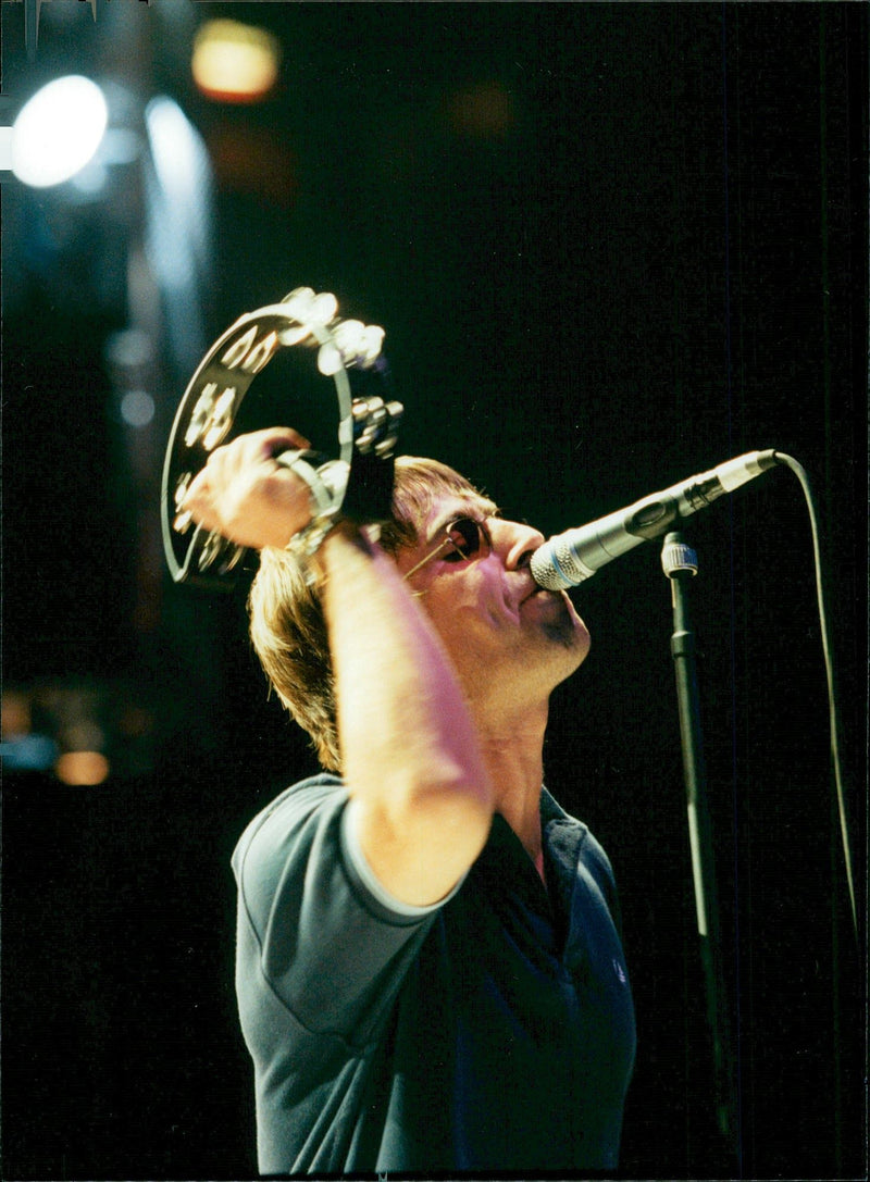 Rock group Oasis member, Liam Gallanger, rock the stage during the group&