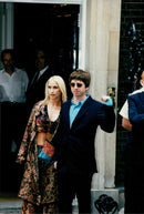 Oasis member Noel Gallagher with his wife Mel on his way to a party. - Vintage Photograph