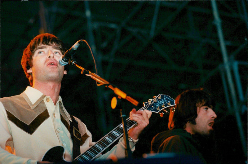 Liam and Noel Gallanger during the rock group concert in Stockholm. - Vintage Photograph