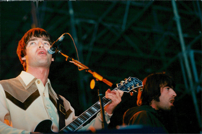 Liam and Noel Gallanger during the rock group concert in Stockholm. - Vintage Photograph