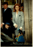 Duke Andrew and Duchess Sarah, together with daughter Beatrice outside the schoolyard. - Vintage Photograph