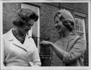 Katharine, Duchess of Kent, in close contact with Princess Alexandra outside Kensington Palace. - Vintage Photograph
