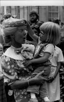 Duke of Kent and Sarah Kerney at a clown tea party at the Guildhall in London. - Vintage Photograph