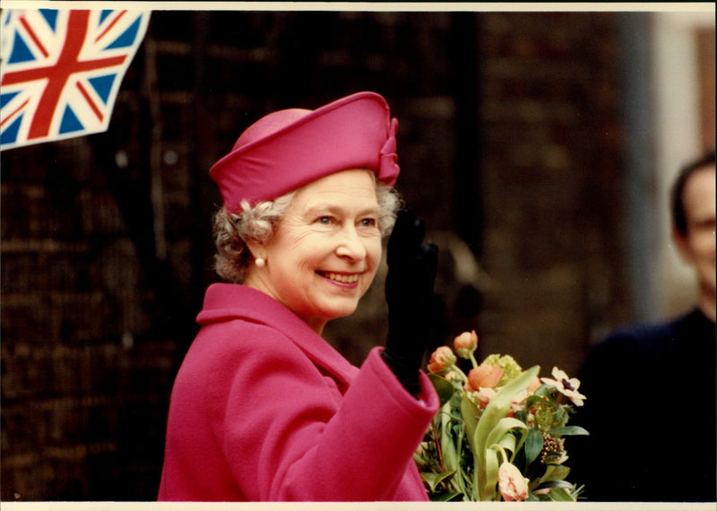 Queen Elizabeth II waving to the people. - Vintage Photograph