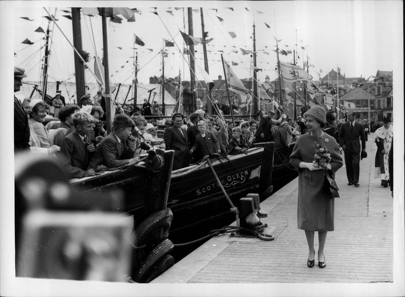 Queen Elizabeth II and Prince Philip walk along the quayside after arriving at Lerwick - Vintage Photograph