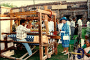 Queen Elizabeth visiting an Indian weaver. - Vintage Photograph
