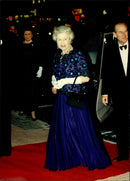 Queen Elizabeth and Prince Philip arrive at the theater. - Vintage Photograph