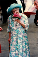 Queen Elizabeth shows up a beautiful bouquet of flowers she received during her 94th birthday. - Vintage Photograph