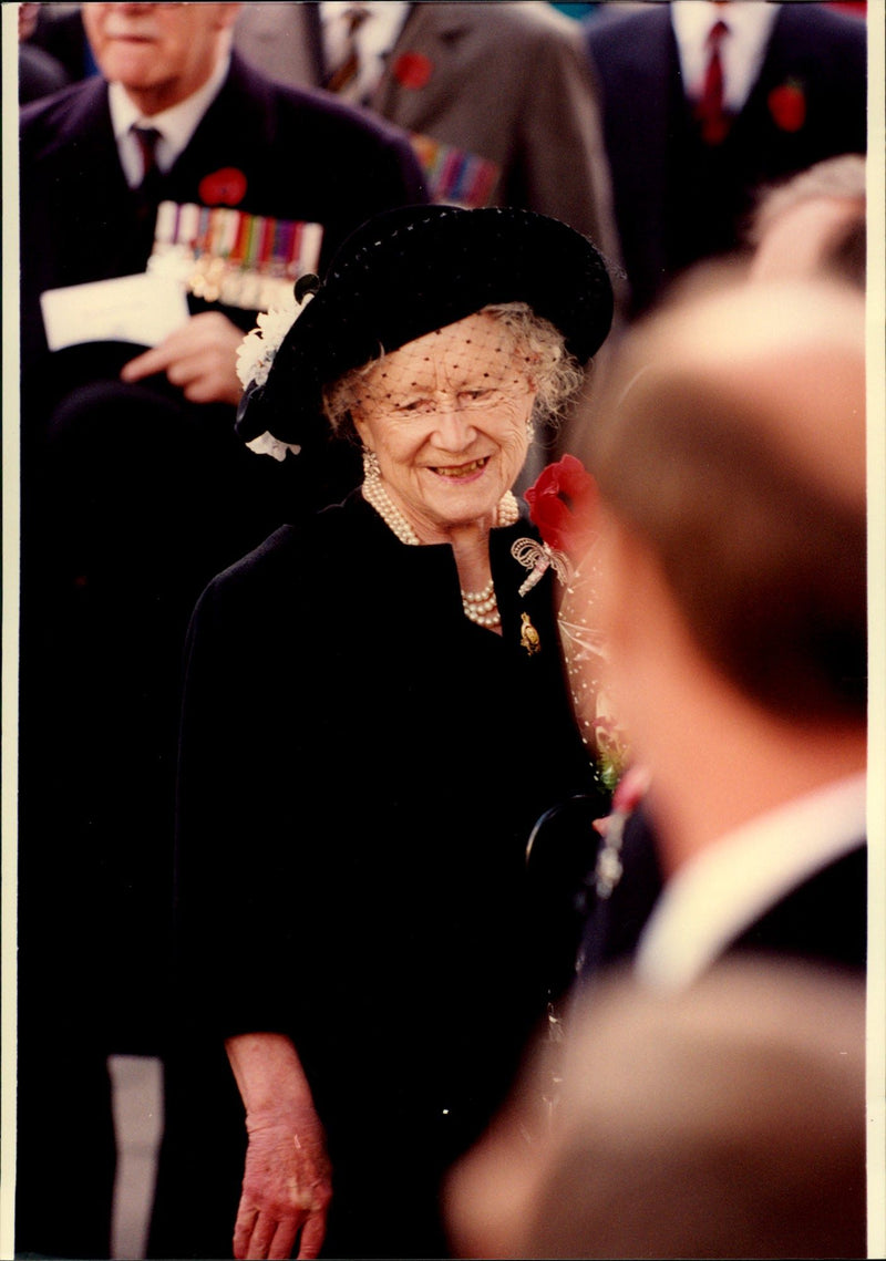 Queen Elizabeth is mingling during an event. - Vintage Photograph