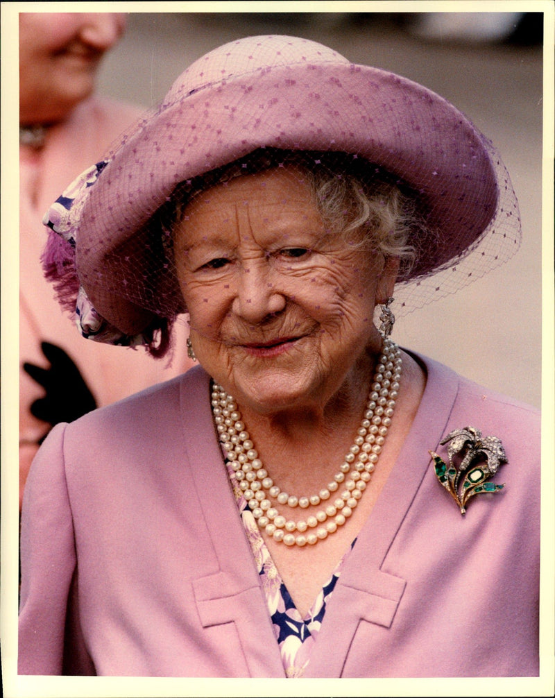 Queen Elizabeth in pink hat with a matching skirt. - Vintage Photograph