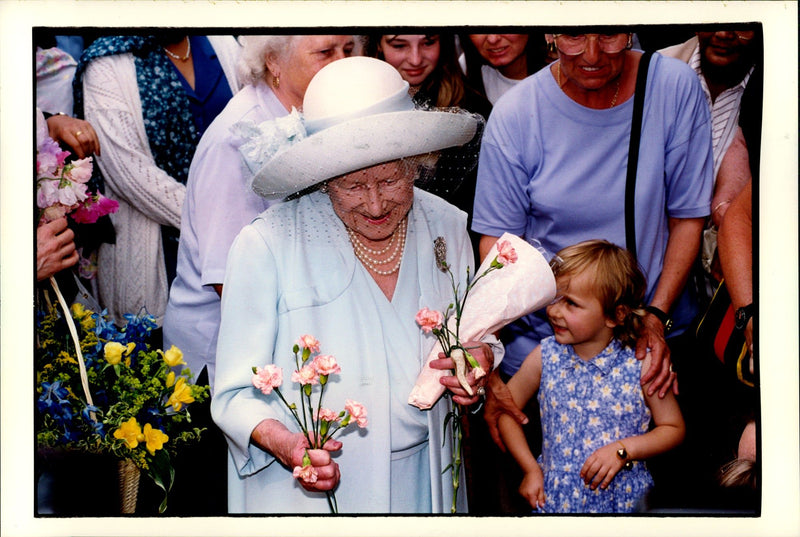 Queen Elizabeth receives flowers of children when she opened the Animal Hospital Blue Cross Animal Hospital. - Vintage Photograph