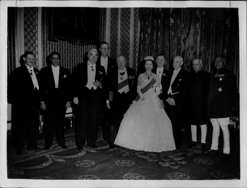 Queen Elizabeth II together with international delegates during a royal dinner at Buckingham Palace. - Vintage Photograph