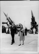 Queen Elizabeth visits English Electric in the new city of Stevenage. In the background, some of the English Electrics Thunderbird air defense robots see - Vintage Photograph