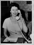 Queen Elizabeth II speaking to the Prime Minister of Canada over the telephone when she inaugurated the CANTAT telephone cable - Vintage Photograph