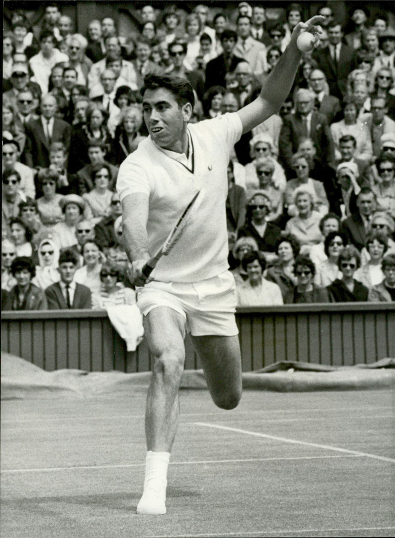 Action shot of Manuel Santana taken in conjunction with the Wimbledon tournament. - Vintage Photograph