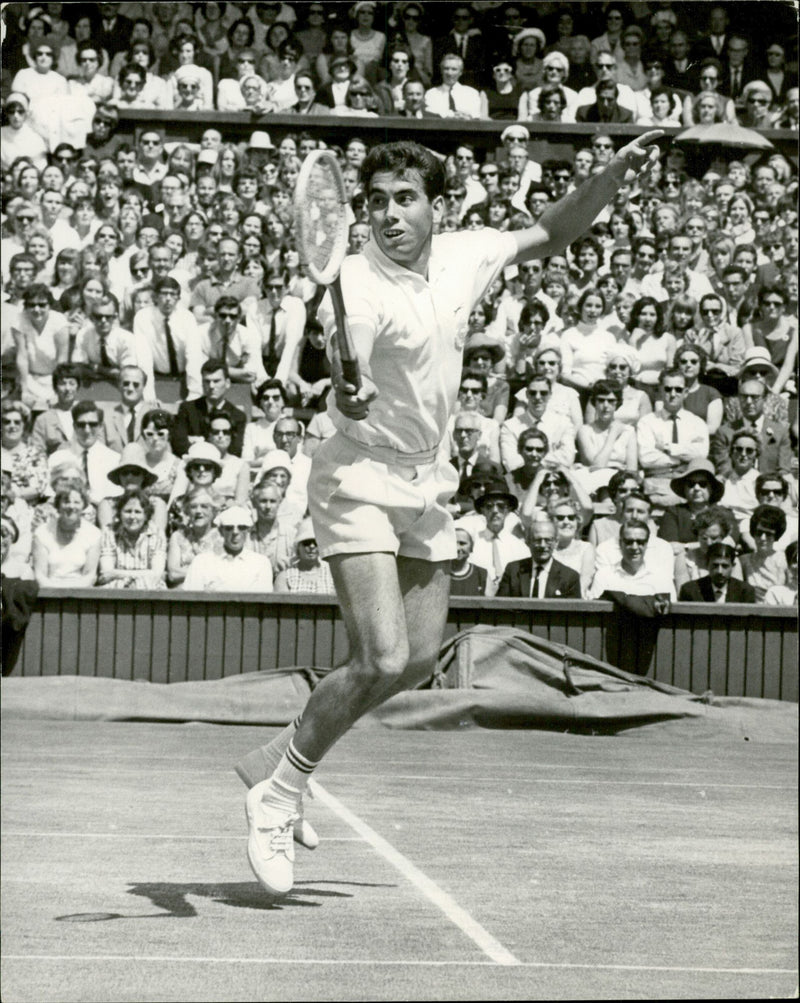 Action shot of Manuel Santana taken in connection with the Wimbledon Open. - Vintage Photograph