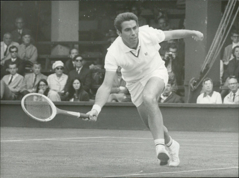 Action shot of Manuel Santana taken in connection with the Wimbledon Open. Opponents were Stillwell from the UK. - Vintage Photograph