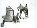 Ice hockey player Sven Tumba down at the goal of the ice hockey match Sweden-CSSR during the Winter Olympics in Innsbruck in 1964 - Vintage Photograph
