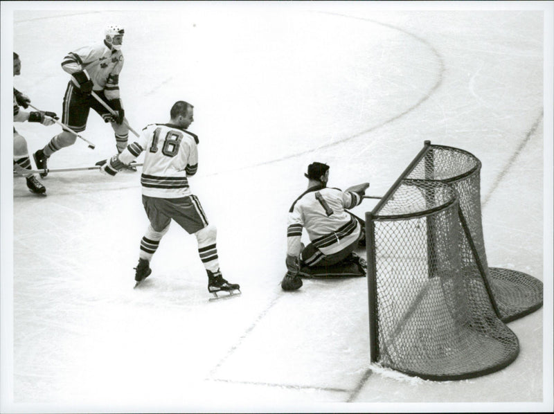 Ice hockey player Sven Tumba down at the goal of the ice hockey match Sweden-CSSR during the Winter Olympics in Innsbruck in 1964 - Vintage Photograph