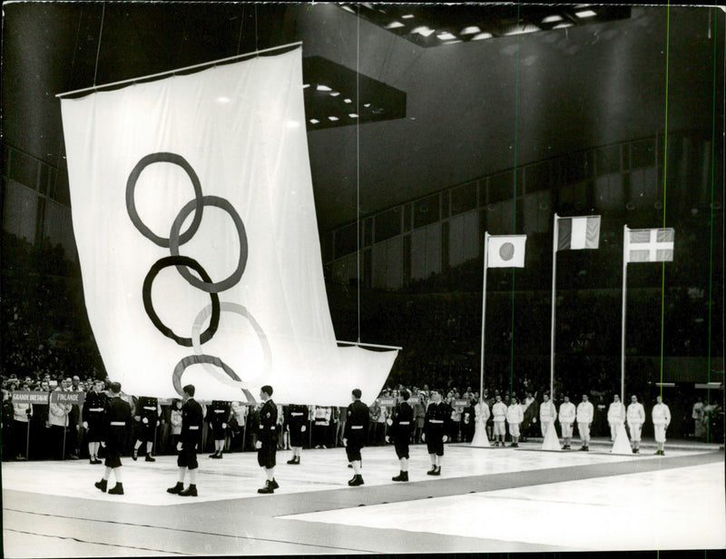 The Olympic flag is lifted at the closing ceremony during the 1968 Olympic Winter Games - Vintage Photograph