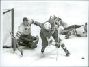 Leif &quot;Honken&quot; Holmquist in the Swedish hockey goal during the match Sweden - Canada during the Winter Olympics in 1968 - Vintage Photograph