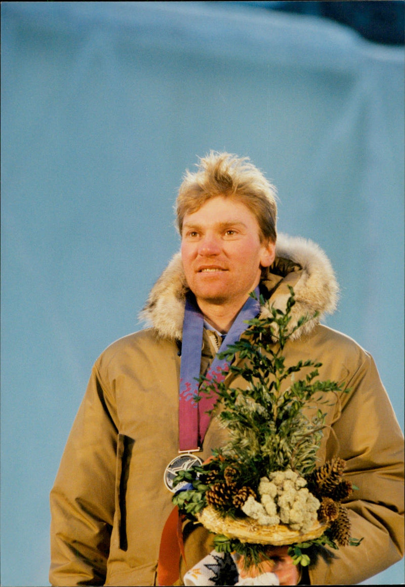 Vladimir Smirnov on the prize pool after his win in 50 km cross country skiing - Vintage Photograph