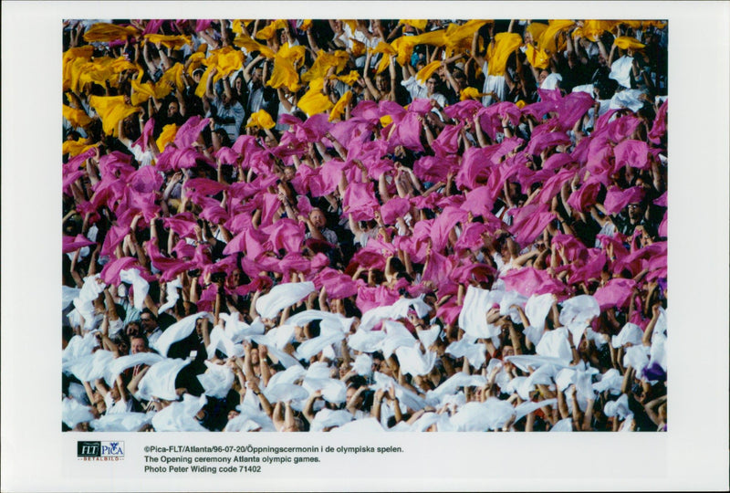 Audience with fabrics of different colors during the opening ceremony of the Olympic Games in Atlanta in 1996 - Vintage Photograph