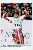 Austrian Mario Reiter raises his arms when it is clear that he won Olympic gold in the alpine combination. - Vintage Photograph