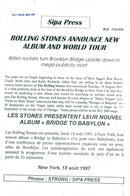 The Rolling Stones announces the album release of Bridges to Babylon under the Brooklyn Bridge - Vintage Photograph