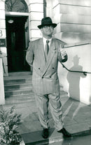 The musician Elton John makes his thumb up against the camera. - Vintage Photograph