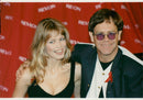 Elton John along with Claudia Schiffer during a charity event. - Vintage Photograph
