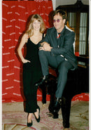 Elton John along with Claudia Schiffer during a charity event. - Vintage Photograph