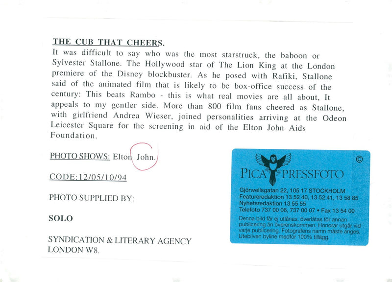 Elton John arrives at the premiere of Disney blockbuster. - Vintage Photograph