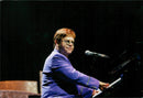 Elton John appears in the Globe during his European Tour. - Vintage Photograph