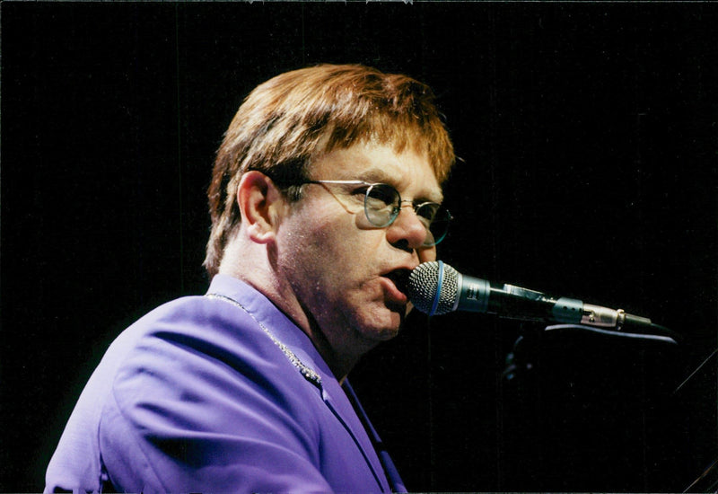 Elton John appears in the Globe during his European Tour. - Vintage Photograph