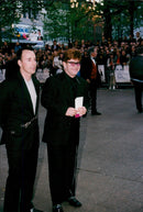 Elton John arrives together with David Furnish to the premiere of &quot;Notting Hill&quot; - Vintage Photograph