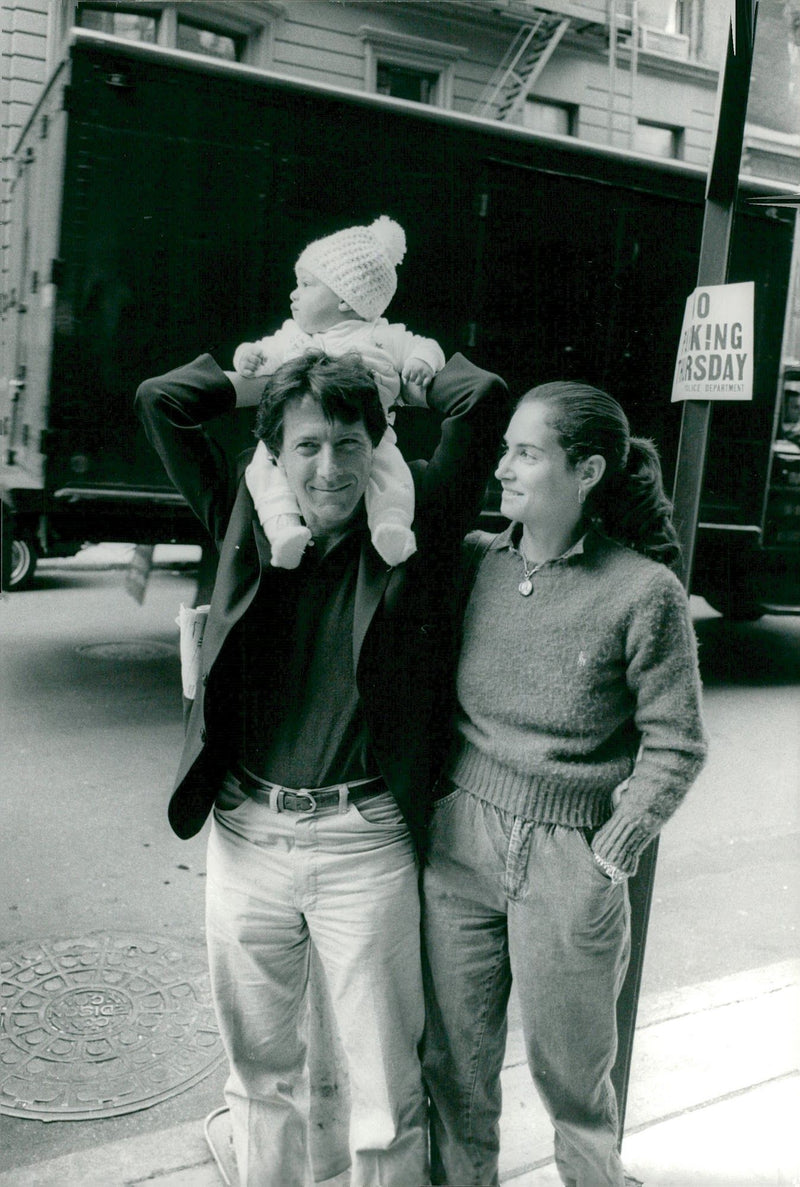 Portrait image of husbands Lisa and Dustin Hoffman and their son Jake, taken in an unknown context. - Vintage Photograph