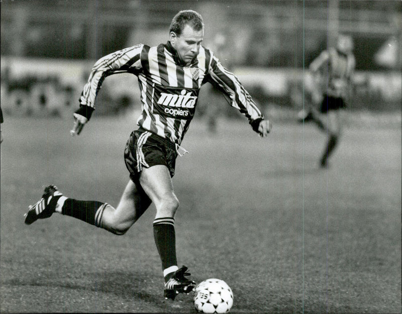 DjurgÃ¥rdens football player Mikael Martinsson runs with the ball. - Vintage Photograph