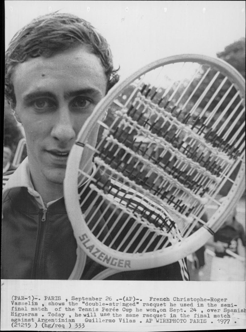 French tennis player Christophe-Roger Vasselin shows the double-stranded racket he used in the semi-final of the Tennis PorÃ©e Cup. - Vintage Photograph