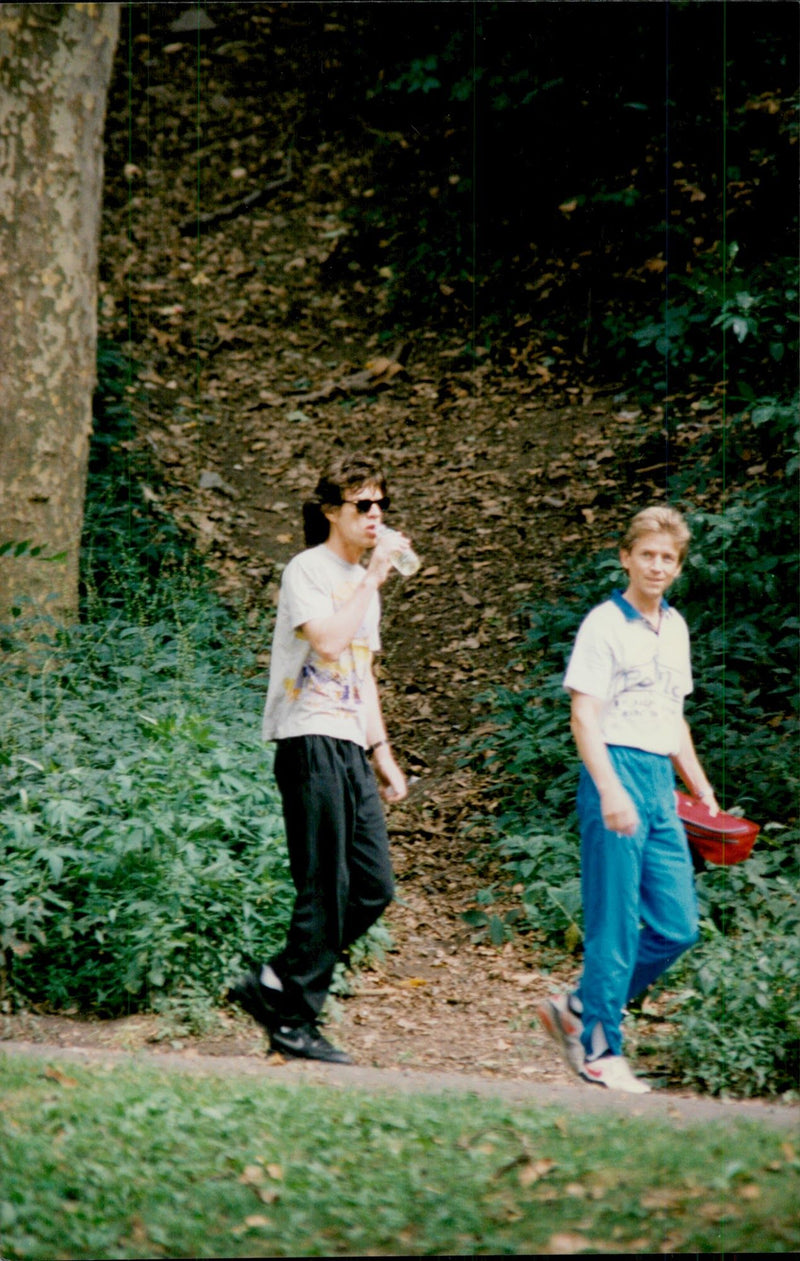 Mick Jagger is jogging with a personal coach in Central Park - Vintage Photograph