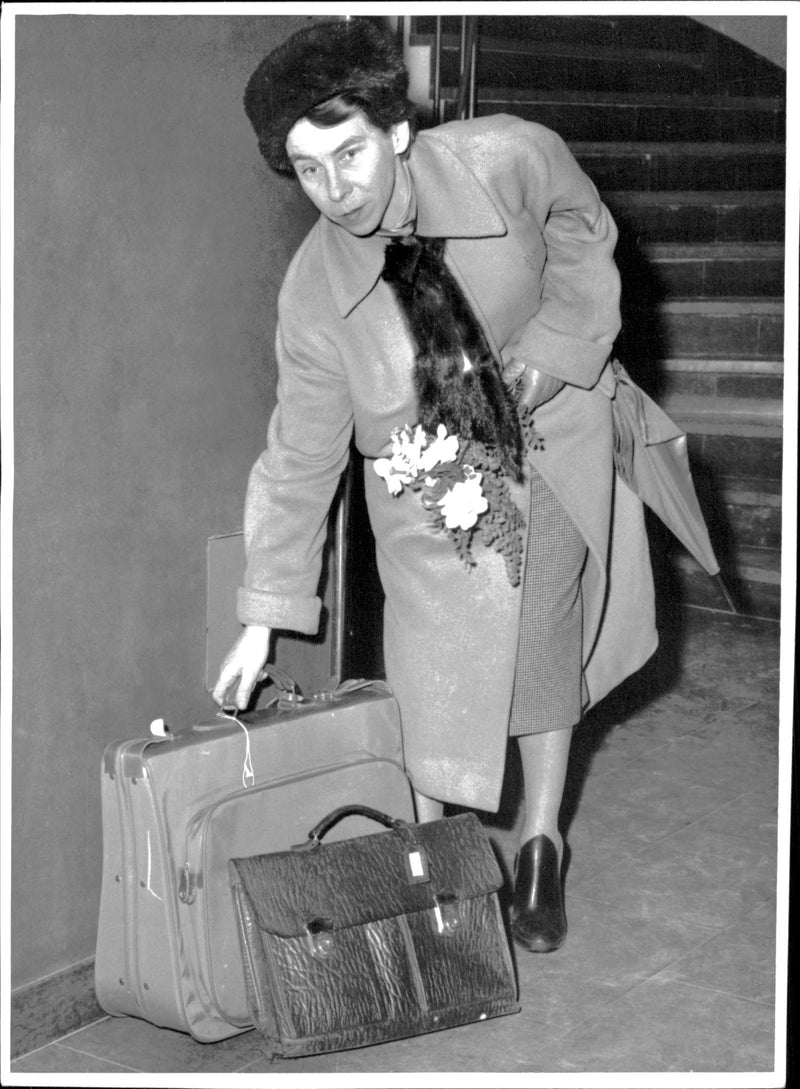 Writer Tove Jansson arrives in Stockholm for a special Muminafton in the choir house at Holländargatan - Vintage Photograph