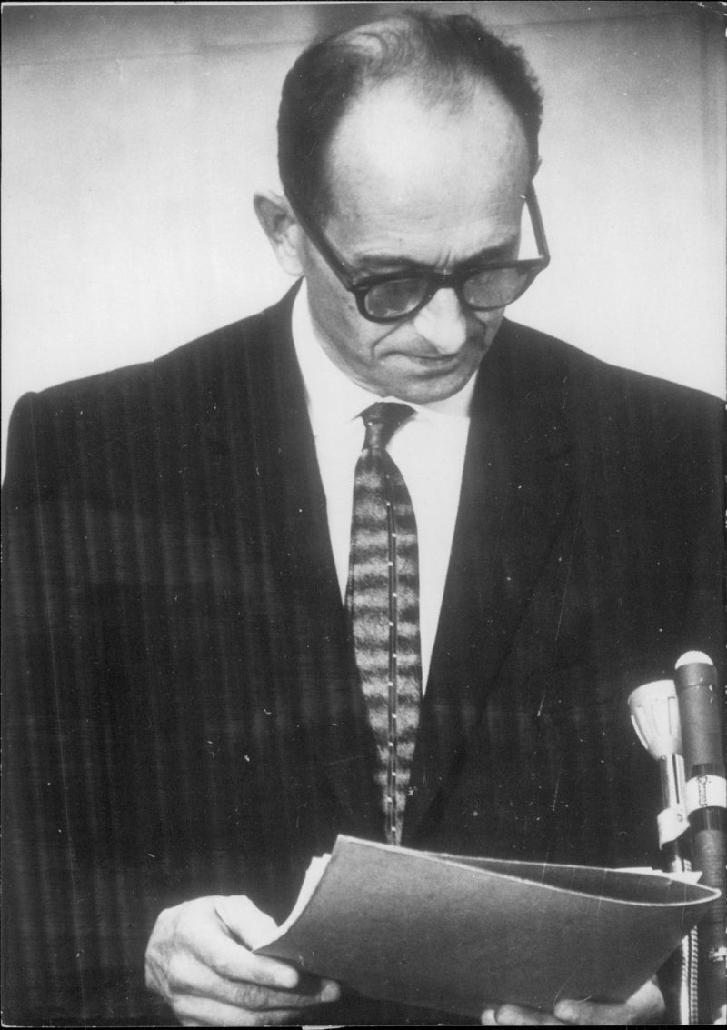 Nazi Adolf Eichmann photographed during the trial in Jerusalem where he was convicted of the death of war crimes and massacres during WWII. - Vintage Photograph