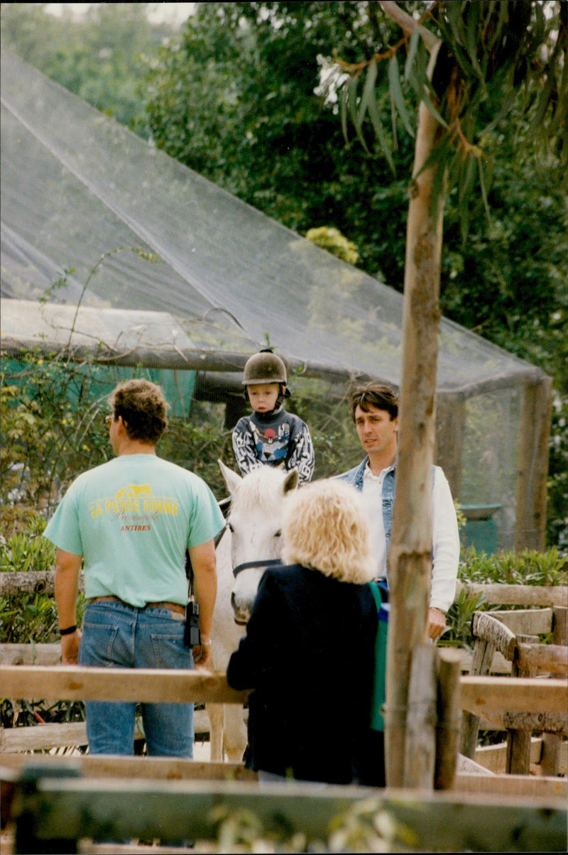 Daniel Ducruet is hanging out with the children Louis and Pauline at an animal and water park. - Vintage Photograph