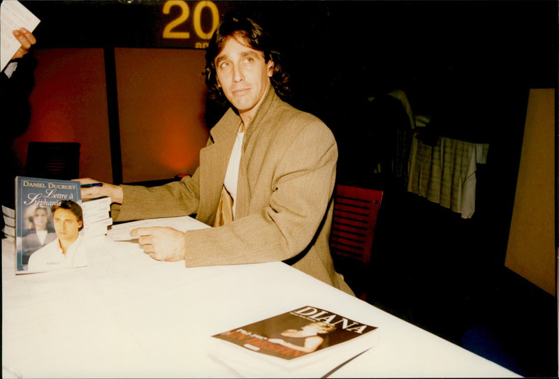 Daniel Ducruet under a book signature. - Vintage Photograph