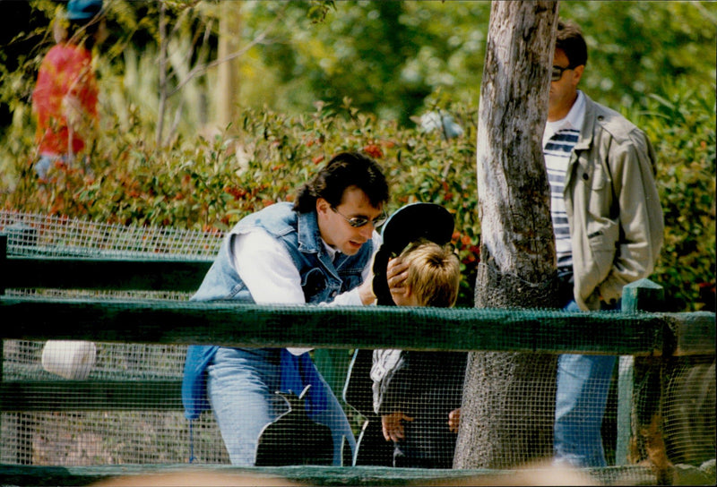 Daniel Ducruet is hanging out with the children Louis and Pauline at an animal and water park. - Vintage Photograph